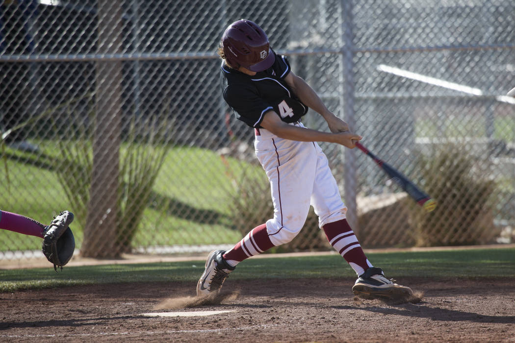 Desert Oasis’ Parker Schmidt (4) swings the bat against Bishop Gorman at Desert Oasis ...