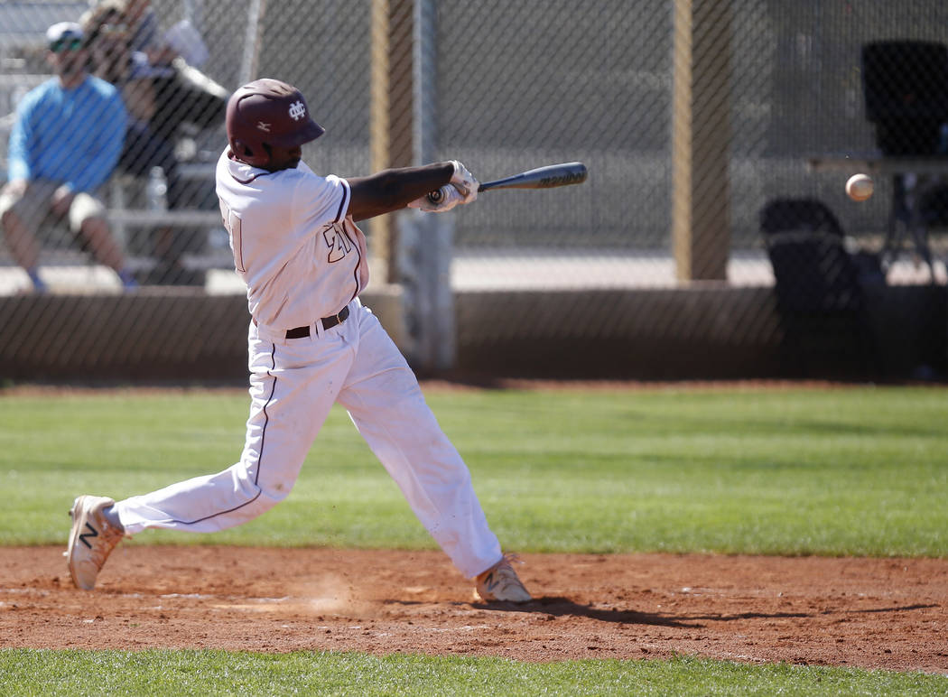 Cimarron-Memorial’s Lasith Narasinghe (21) swings during the first inning of a high sc ...