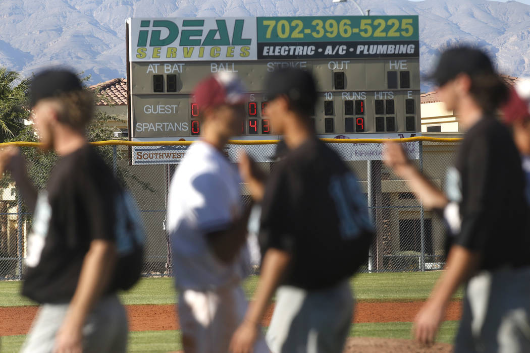 Cimarron-Memorial and Silverado bump fists after a high school baseball game at Cimarron-Mem ...