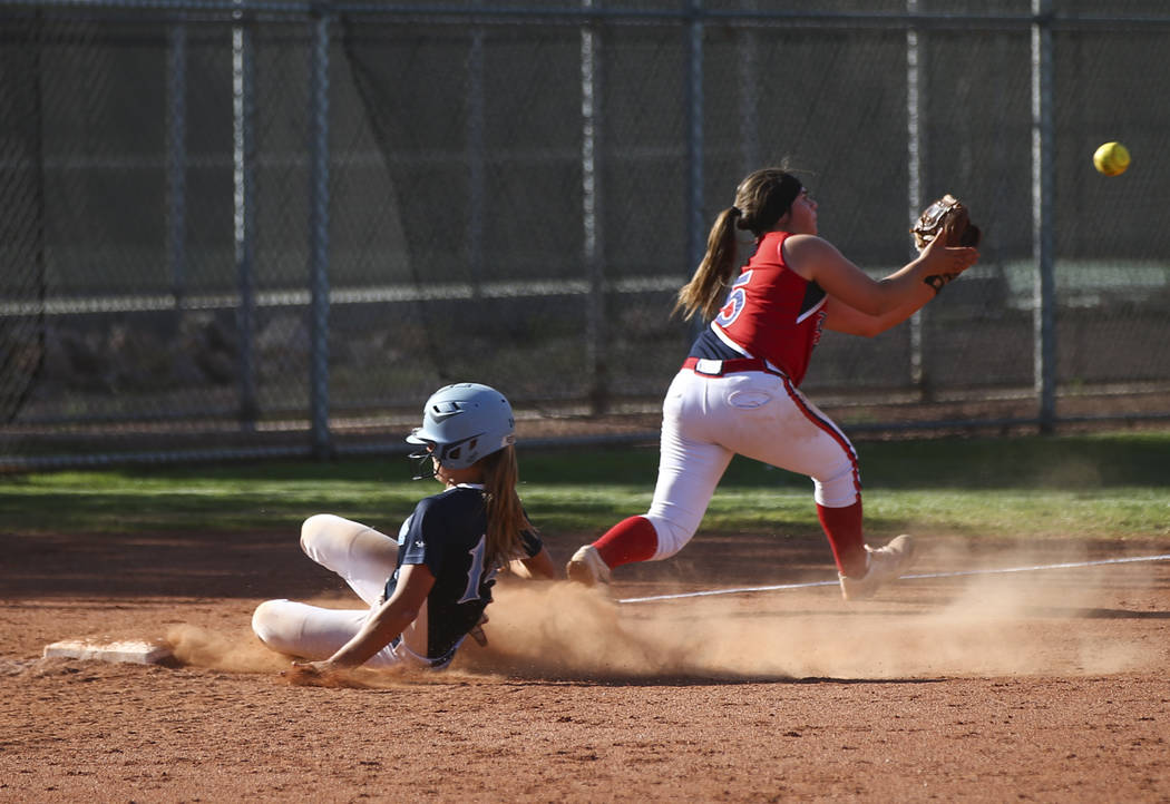 Foothill’s Jocelyn Shupp (14) slides into third base against Liberty’s Breanna A ...