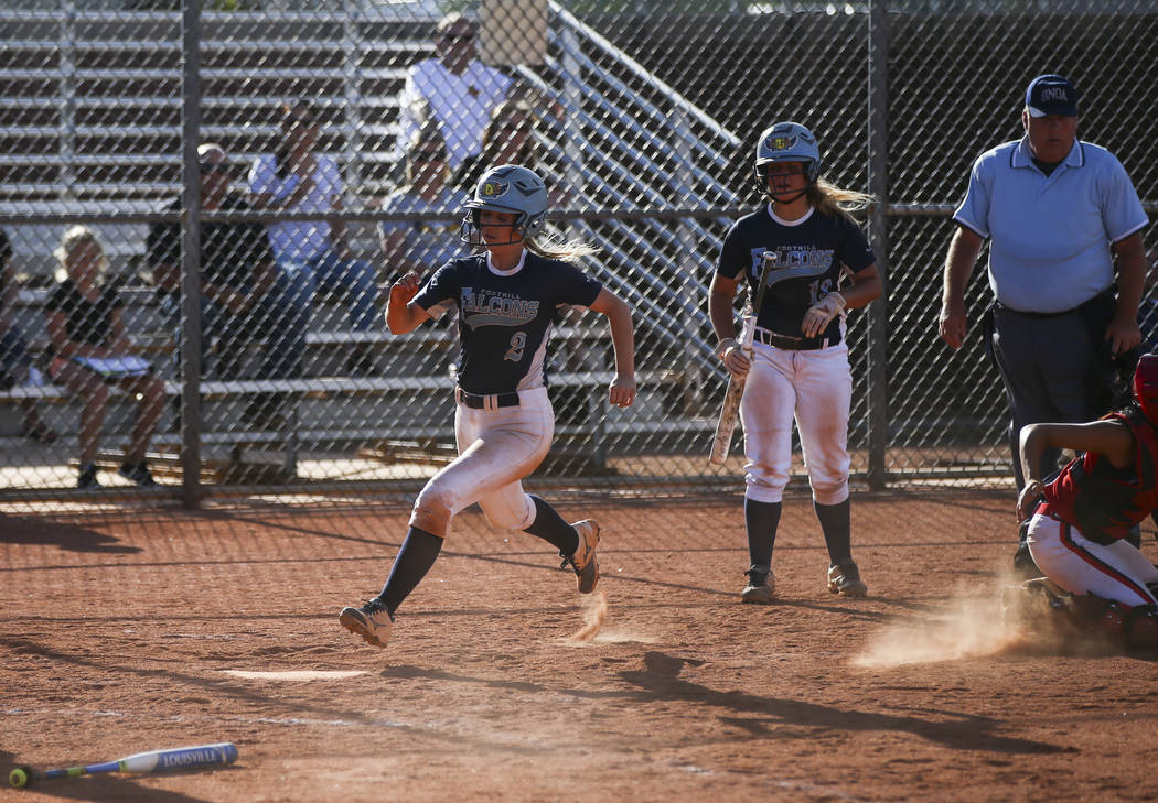 Foothill’s Kylie Becker (2) scores a run against Liberty during a baseball game at Lib ...