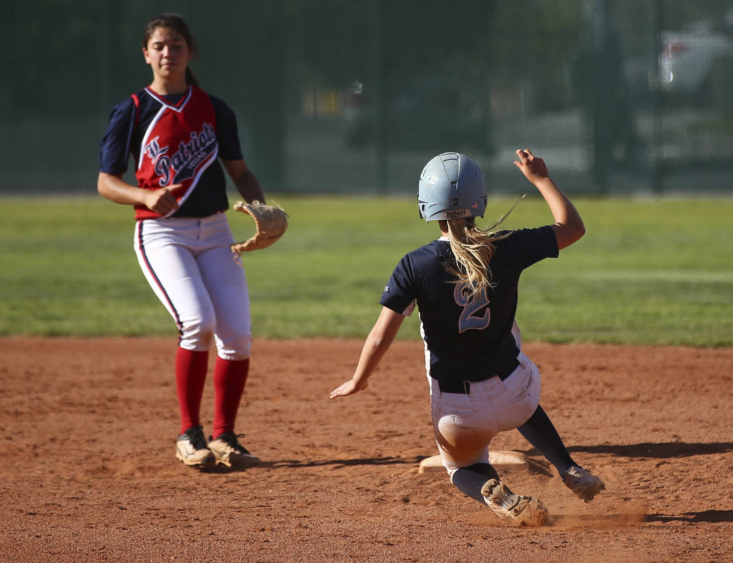 Foothill’s Kylie Becker (2) slides safely into second base against Liberty’s Ash ...