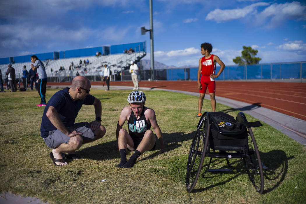Palo Verde’s Ben Slighting, who competes in a wheelchair, talks with his dad, Brad, af ...