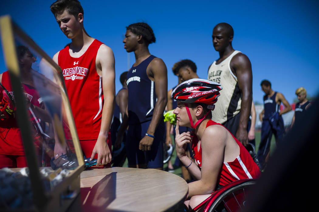 Arbor View freshman Blake Dickinson checks in before competing in the 100-meter dash during ...