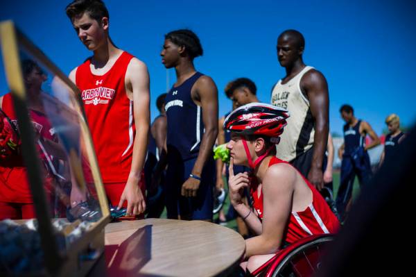 Arbor View freshman Blake Dickinson checks in before competing in the 100-meter dash during ...