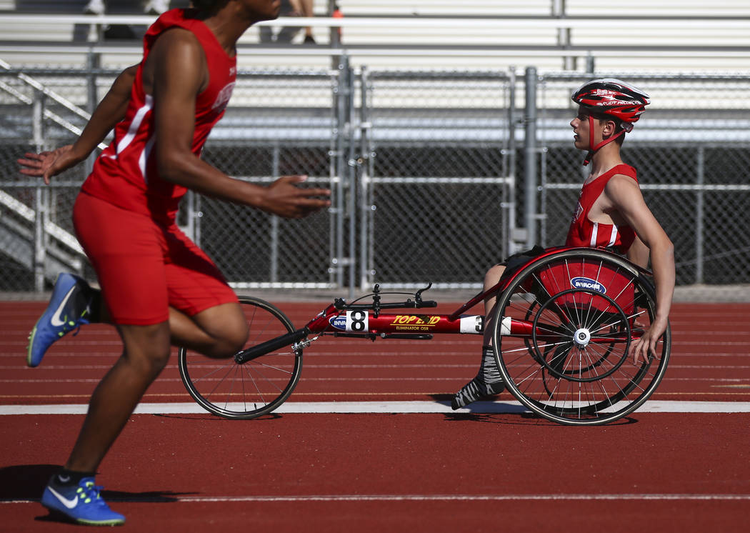 Arbor View freshman Blake Dickinson, right, between events during a track and field meet at ...