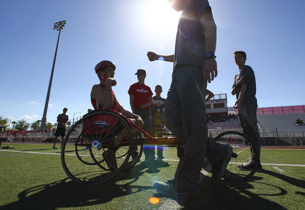 Arbor View freshman Blake Dickinson greets a teammate before competing in the 100-meter dash ...