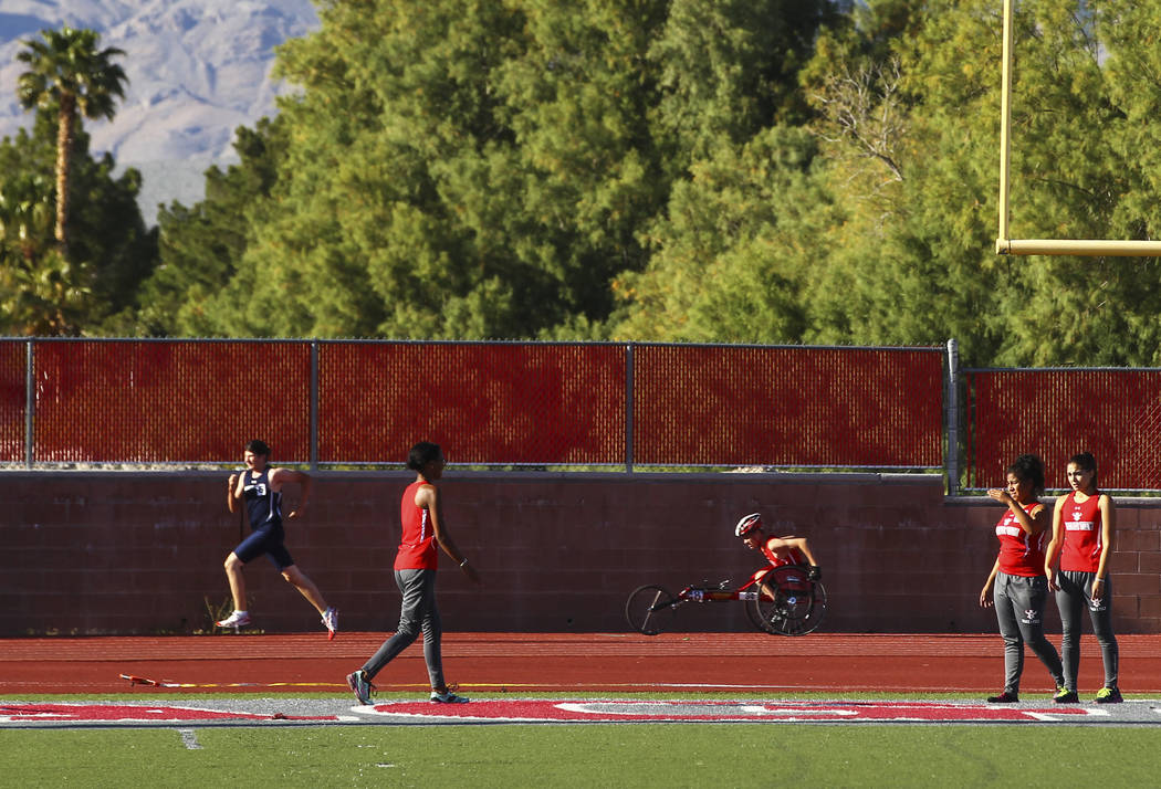 Arbor View freshman Blake Dickinson competes in the 400-meter dash during a track and field ...