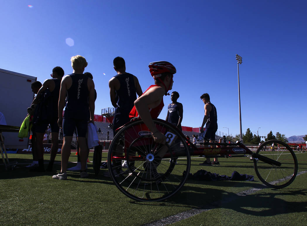 Arbor View freshman Blake Dickinson prepares to compete in the 100-meter dash during a track ...