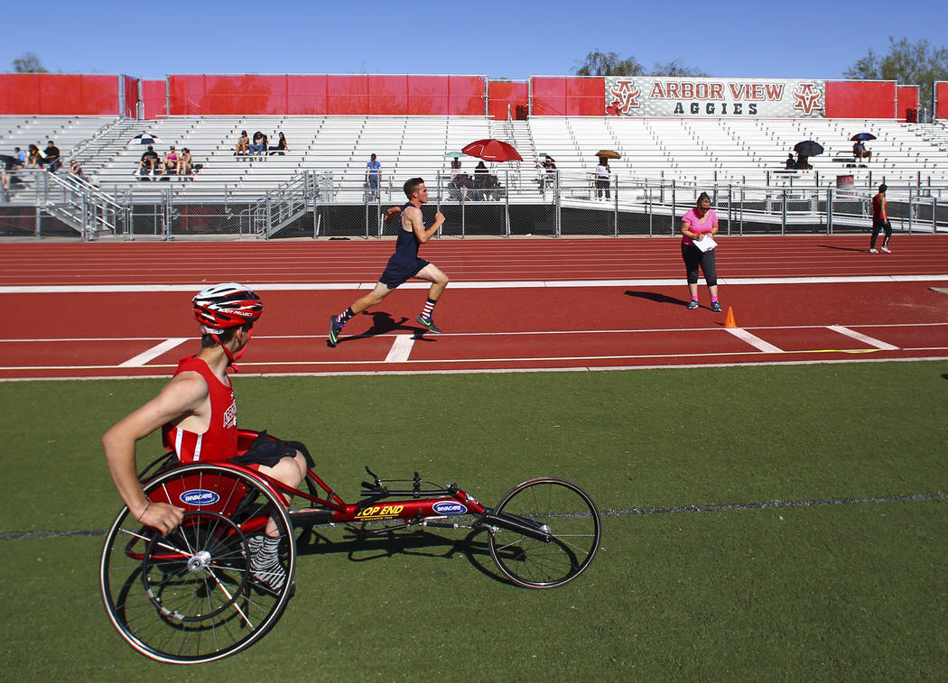 Arbor View freshman Blake Dickinson, left, between events during a track and field meet at A ...