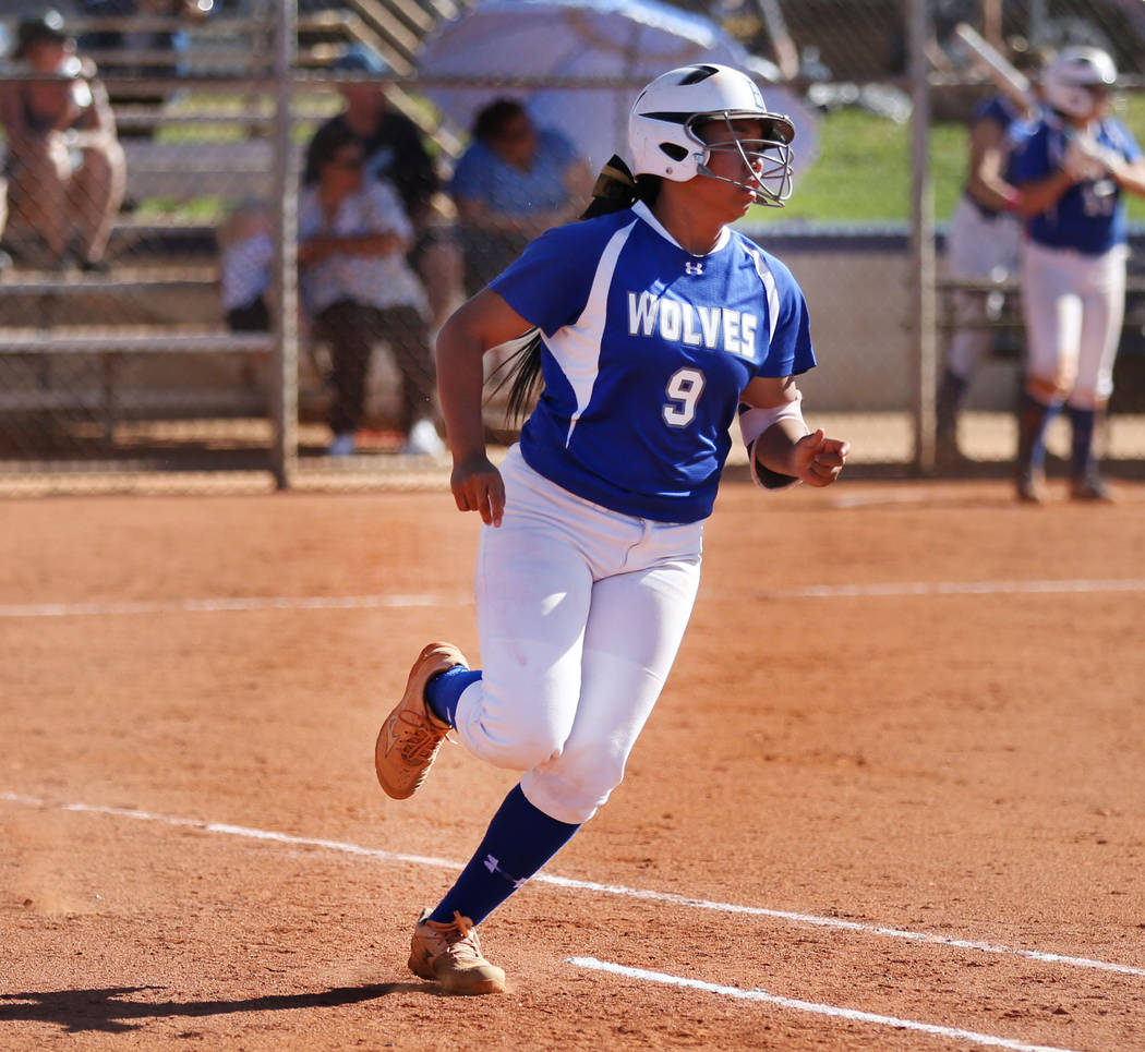 Basic High School’s shortstop Sanoe Helenihi successfully runs to first base against F ...