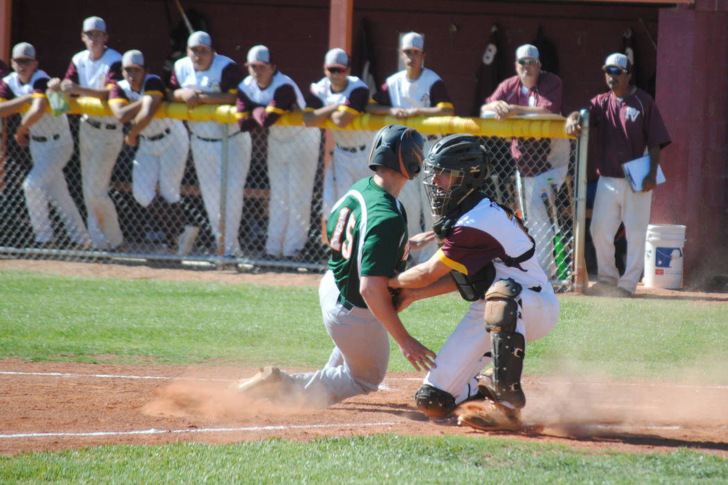 Pahrump Valley catcher Willie Lucas tags out Mojave’s Reece McClian at Pahrump Valley ...