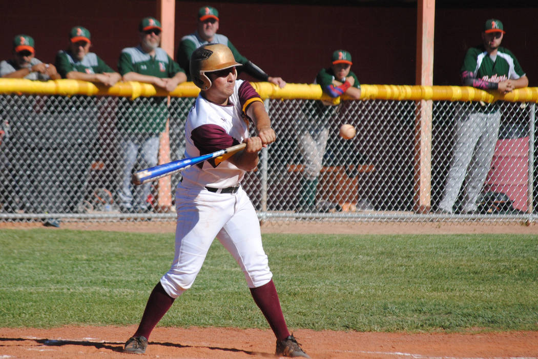 Pahrump Valley’s Anthony Charles connects for an RBI single against Mojave at Pahrump ...