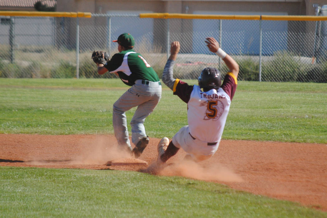 Pahrump Valley’s Paker Hart slides safely into second base against Mojave at Pahrump V ...