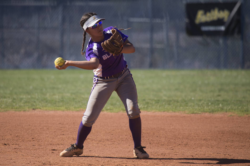 Durango’s Destiny Cisneros (13) turns for a throw to second base for an out against Si ...