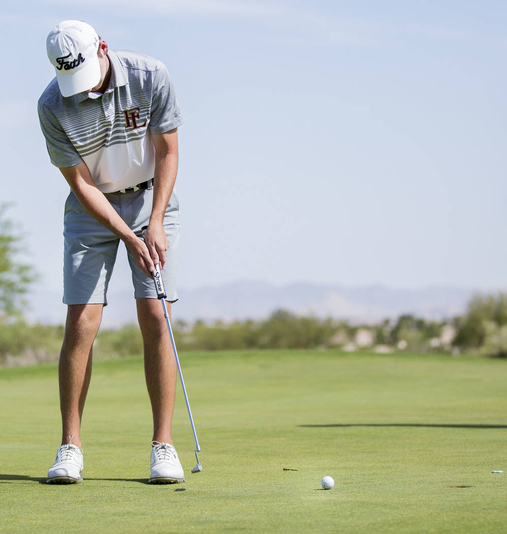 Faith Lutheran’s Charlie Magruder finishes the 18th hole during Sunset Region boys gol ...