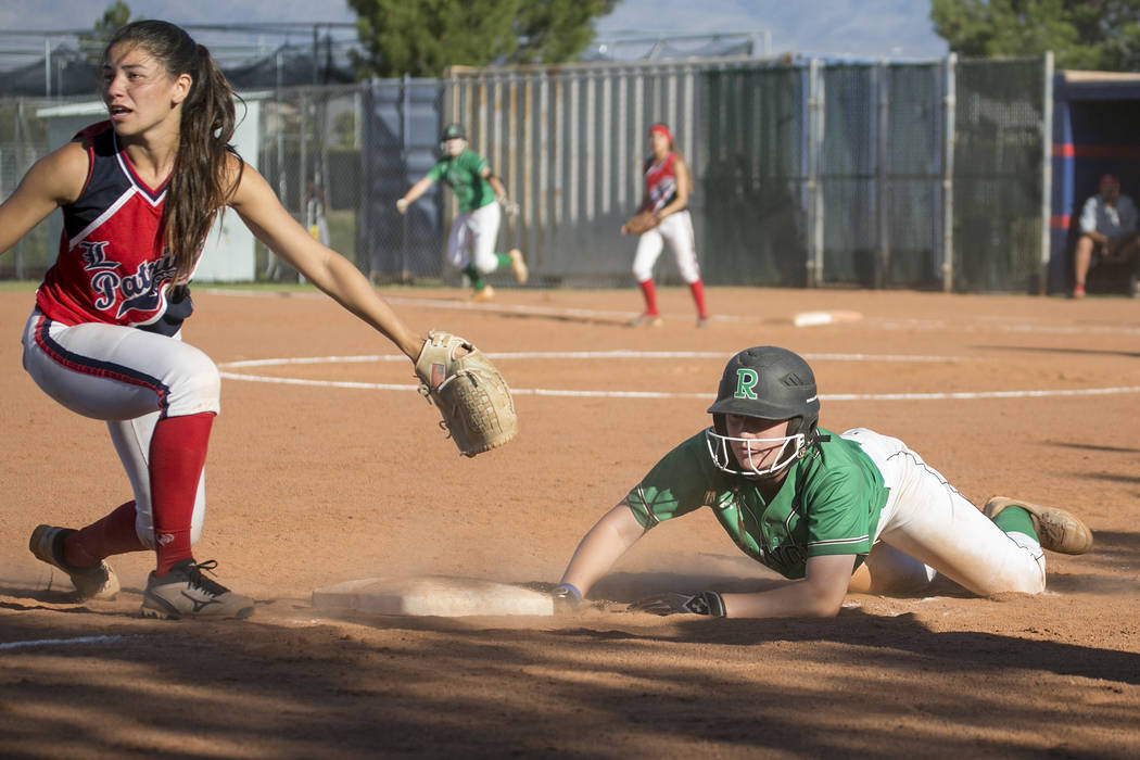 Rancho junior Gianna Carosone slides into third during the team’s playoff game against ...