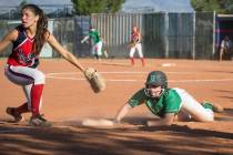 Rancho junior Gianna Carosone slides into third during the team’s playoff game against ...