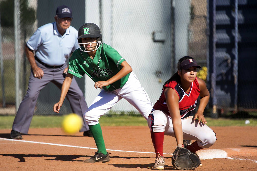Rancho sophomore Bryana Gonzales, left, takes off from first base while the ball is pitched ...
