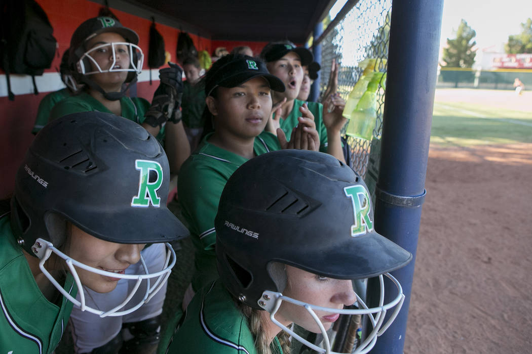 Rancho teammates cheer from the dugout during the team’s playoff game against Liberty ...