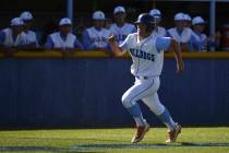 Centennial’s Austin Kryszczuk heads for home base to score a run against Desert Oasis& ...