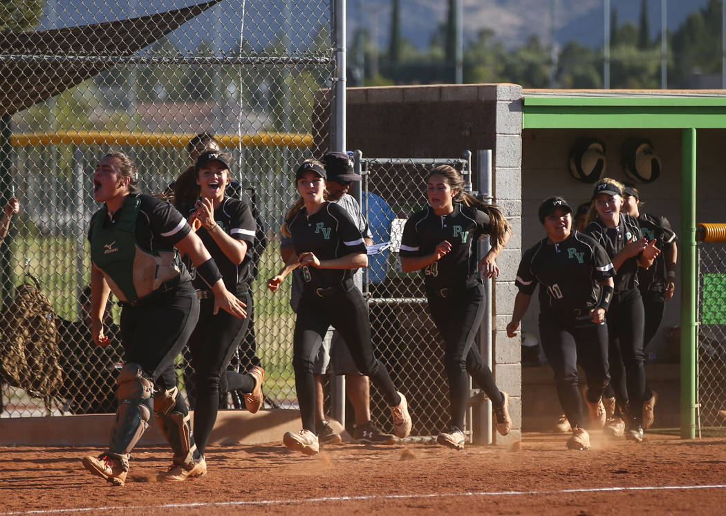 Palo Verde players react to a home run hit by Palo Verde’s Lauryn Barker, not pictured ...