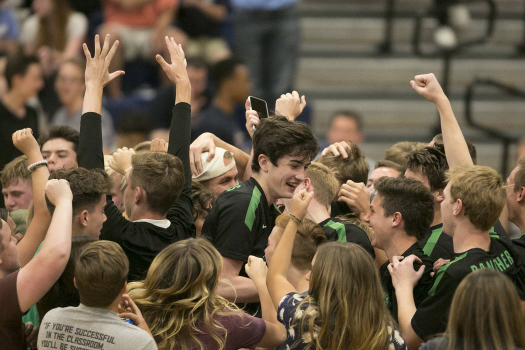 Palo Verde fans storm the court to celebrate the team’s win over Centennial for the Su ...