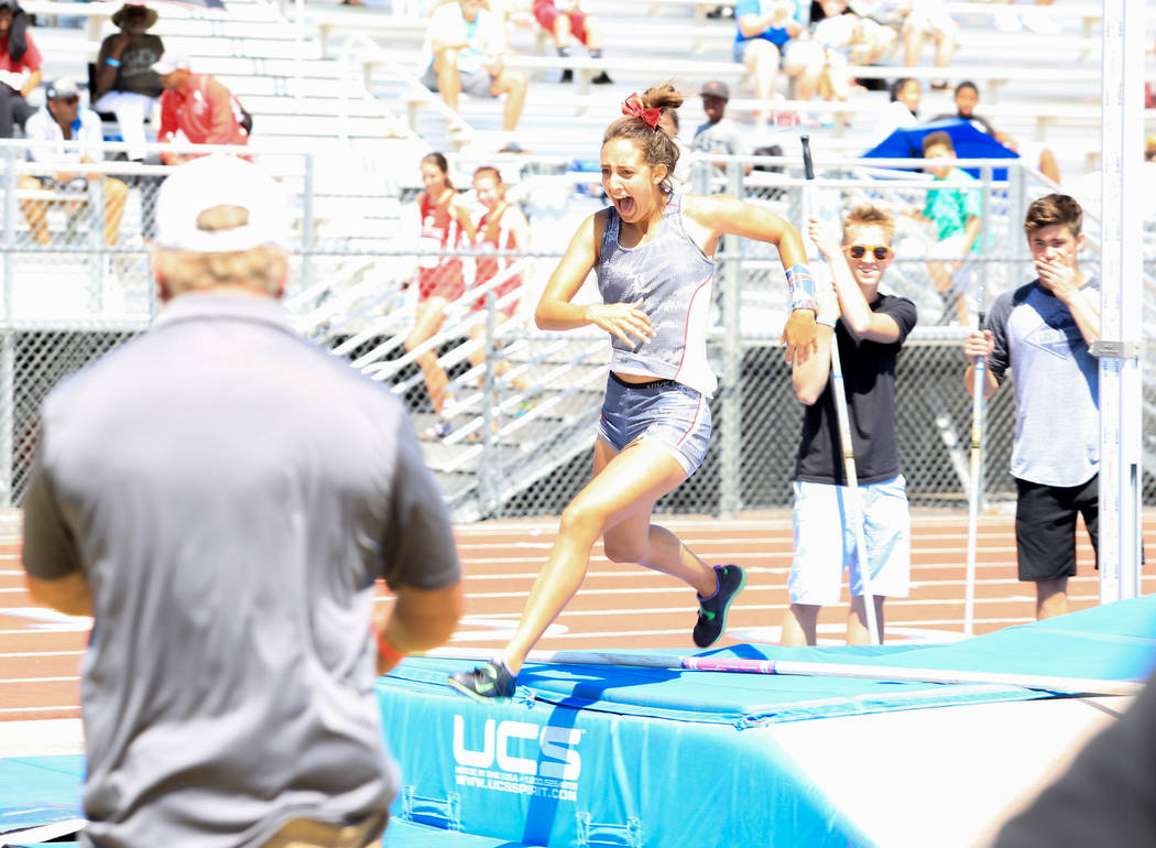 Gabby Carson, of Liberty High School, celebrates setting a new Sunrise Region record in the ...