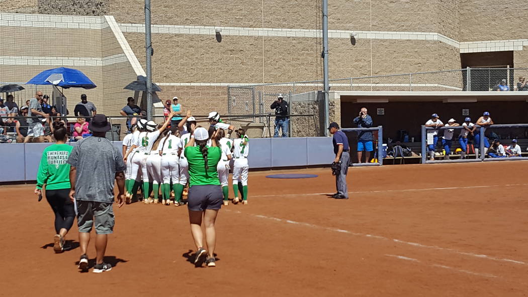 Cara Beatty is greeted at home plate by her Palo Verde teammates after hitting a grand slam ...