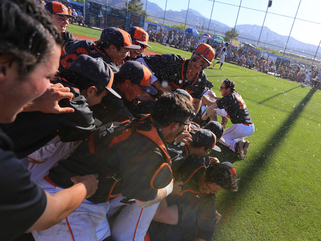 Bishop Gorman players celebrate winning the Sunset Region baseball championship game over Ce ...