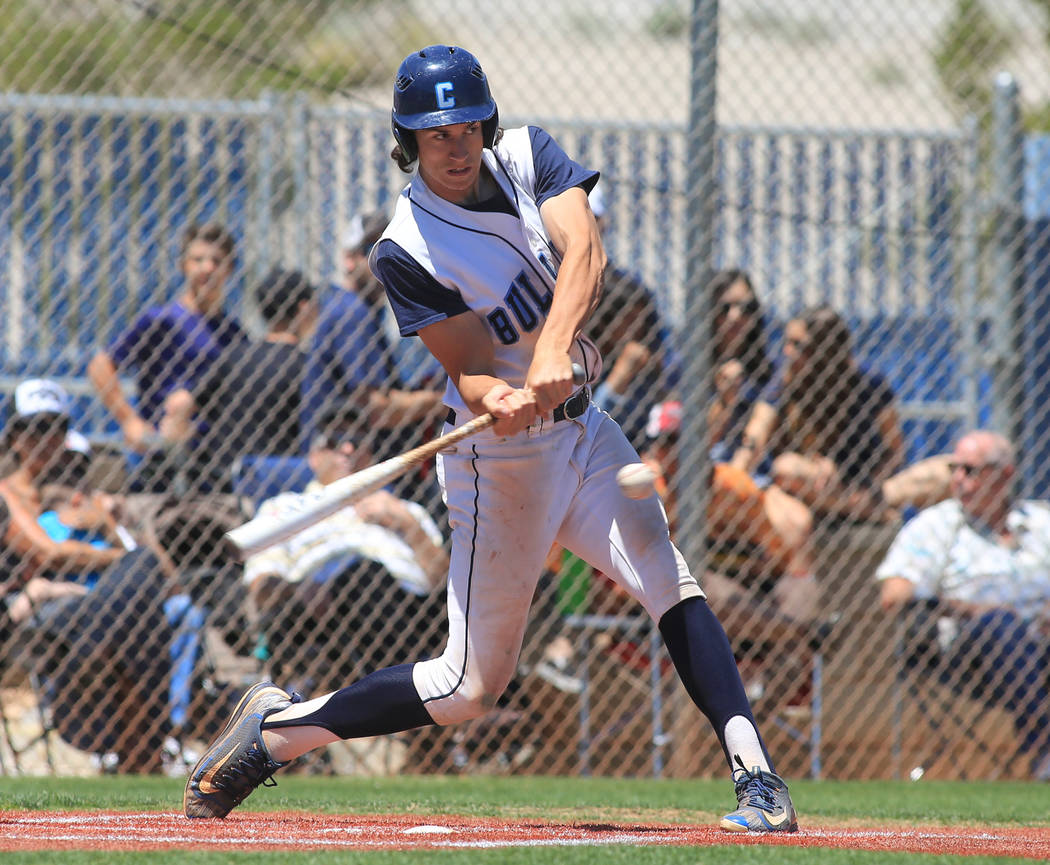 Centennial batter Brett Berger (20) takes a swing during the Sunset Region baseball champion ...