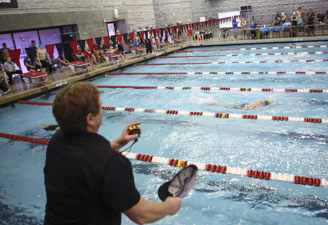 Palo Verde head coach Brent Gonzalez motions to his swimmers during the Sunset Region ...