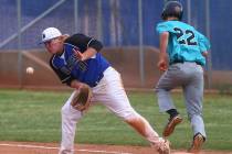 Silverado’s Tyler Paasche (22) makes it to first base against Basic’s Jack Wold ...