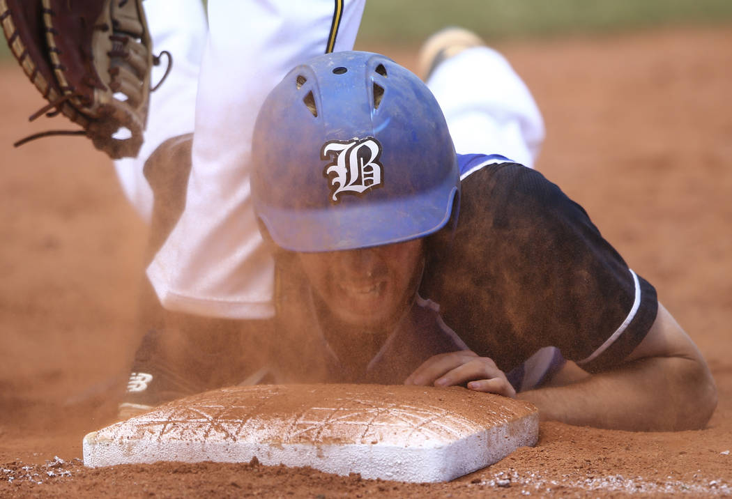 Basic’s Roger Riley avoids getting tagged out by Galena’s Austin Wickham, not pi ...
