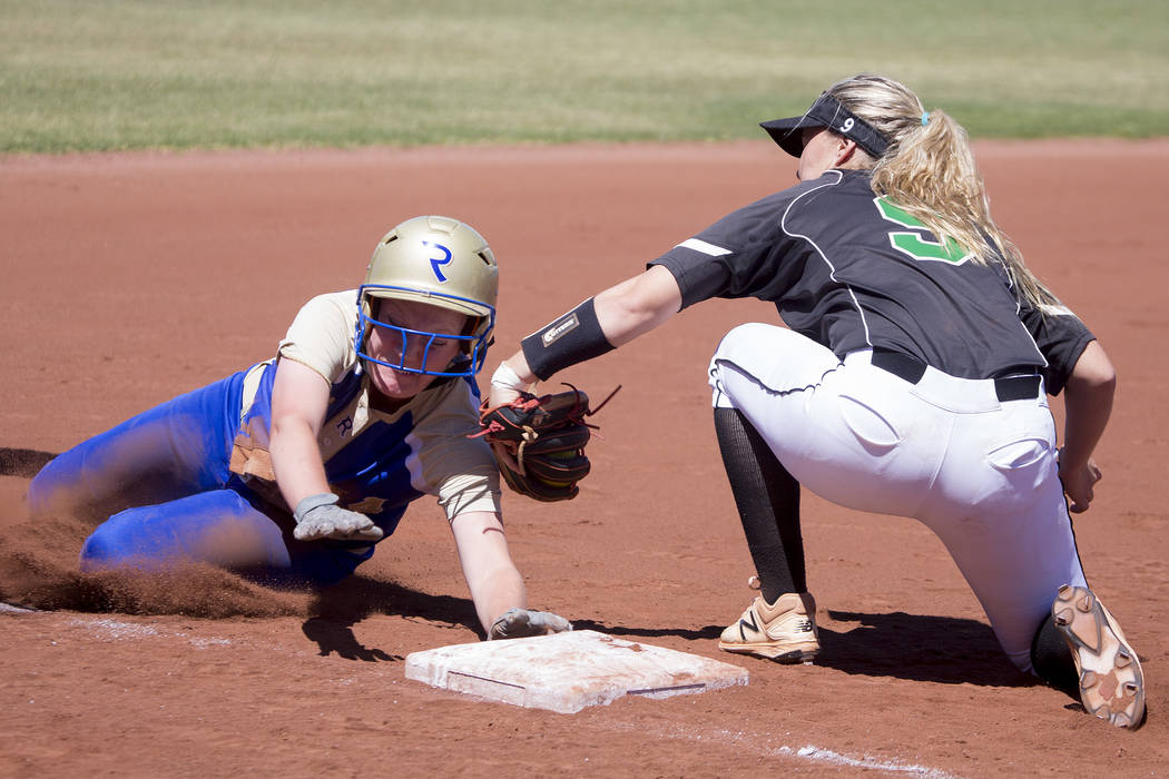 Palo Verde junior Lauryn Barker tags Reed senior Jessica Sellers out on third base during a ...