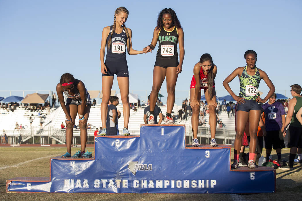 Centennial senior Karina Haymore (191), who placed second, holds hands with Rancho junior Gi ...