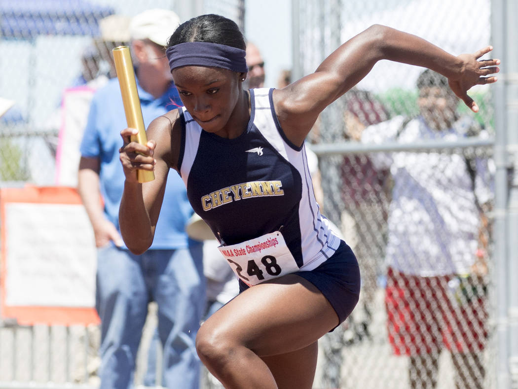 Cheyenne sophomore Germanie White begins the first leg of the girls 400-meter relay during t ...