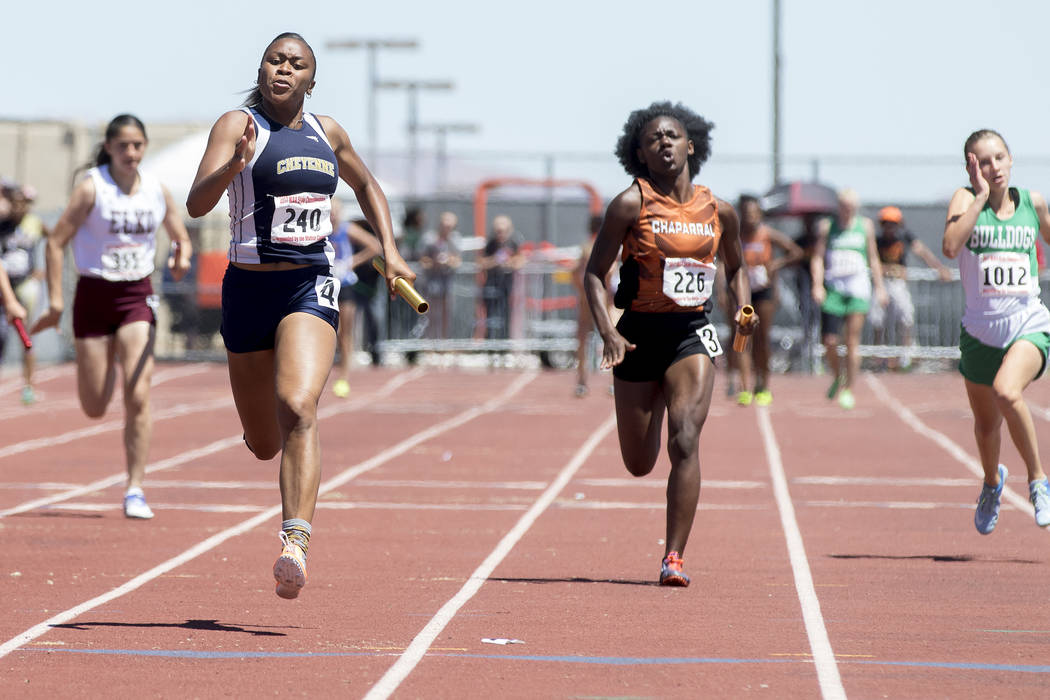 Cheyenne senior Angela Hammond finishes the last leg of the girls 400-meter relay during the ...