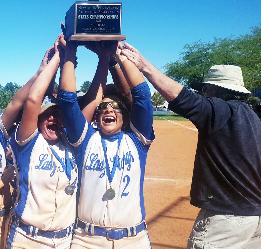 Jaycee Fragoso and Brenna Chavez hoist the Class 2A State Championship trophy after Needles ...