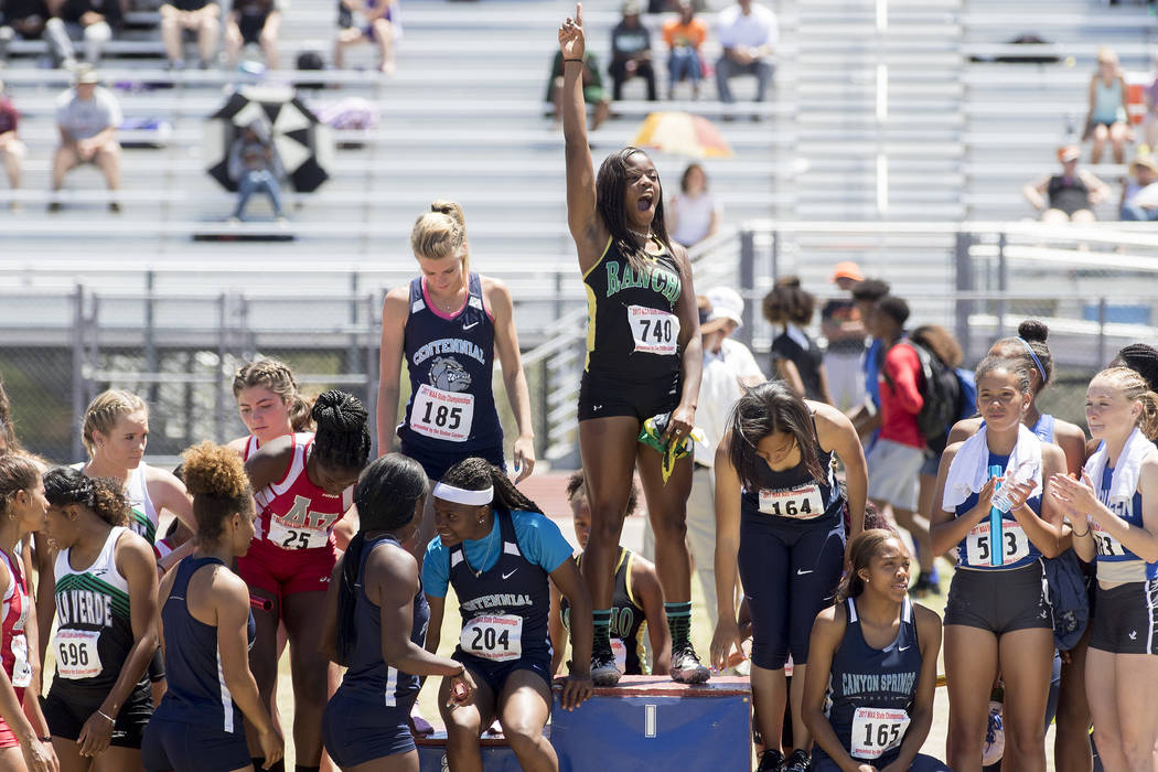 Girls 4×100-meter relay runners fill the podium for their medals during the NIAA 4A Sta ...