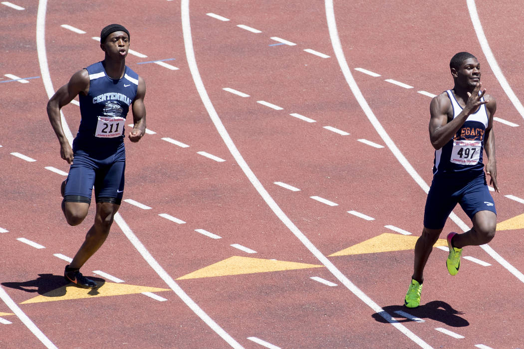 Centennial junior Randall Jubilee catches up to Legacy junior Jeriel Thomas in the boys 400- ...