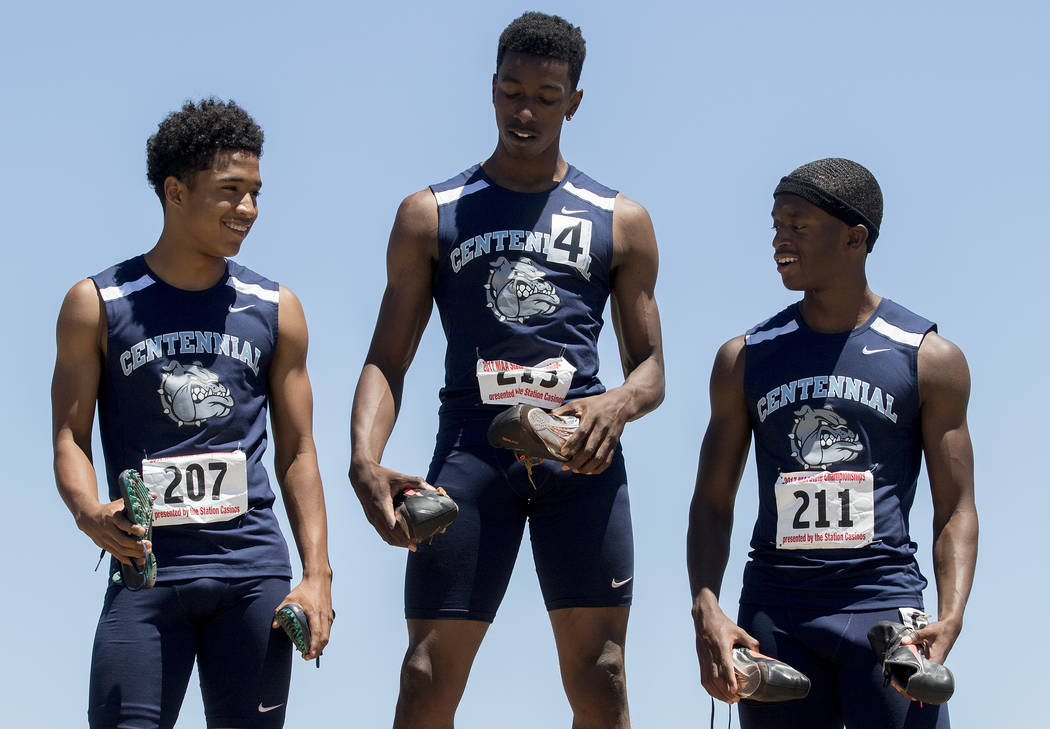 Centennial runners Tre Harley, left who placed second, Savon Scarver, who placed first, and ...