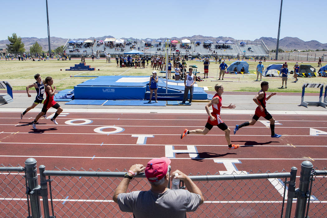 A spectator watches events at the NIAA State Track & Field Championships at Foothill Hig ...