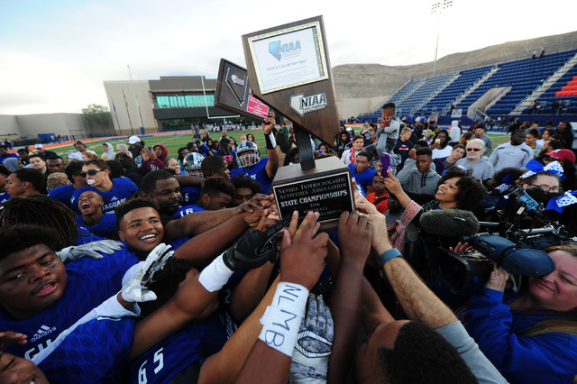 Desert Pines players celebrate their 39-6 win over Spring Creek during the NIAA Class 3A Sta ...