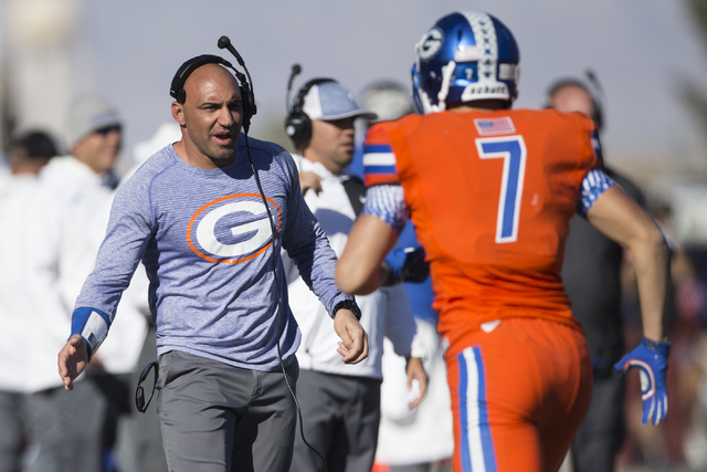 Bishop Gorman’s head football coach Kenny Sanchez reaches his hand for Biaggio Walsh ( ...