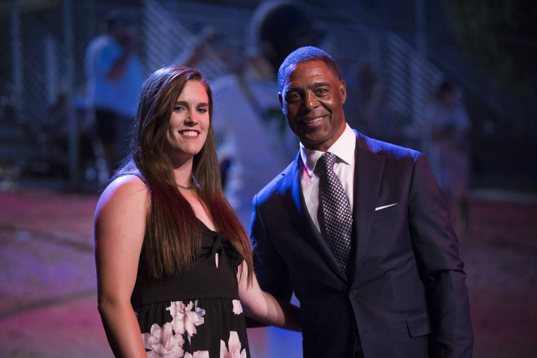 Samantha Pochop, left, is presented with the Female Athlete of the Tear Award by football ha ...