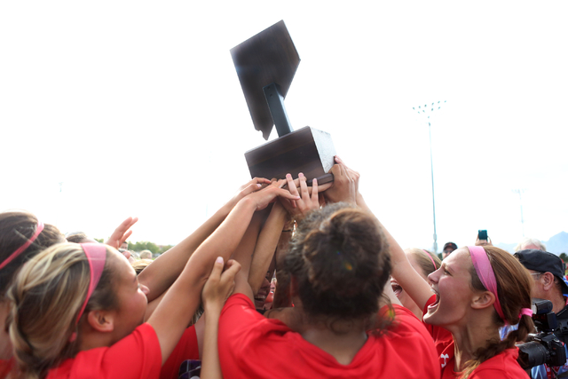 Arbor View celebrate holding their trophy after their victory against Palo Verde at the Bett ...