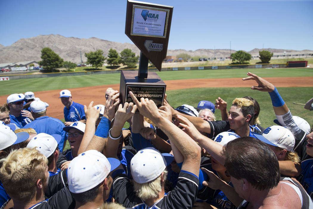 Basic players celebrate with their trophy after defeating Galena in the NIAA Class 4A State ...