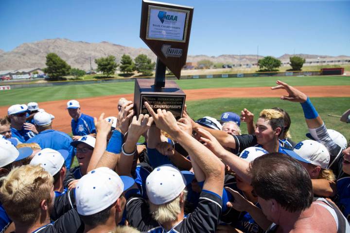 Basic players celebrate with their trophy after defeating Galena in the NIAA Class 4A State ...