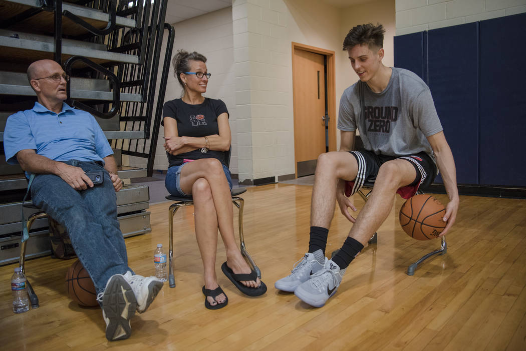 Zach Collins catches up with Heather Collins and Ivan Mitchell after his training session at ...